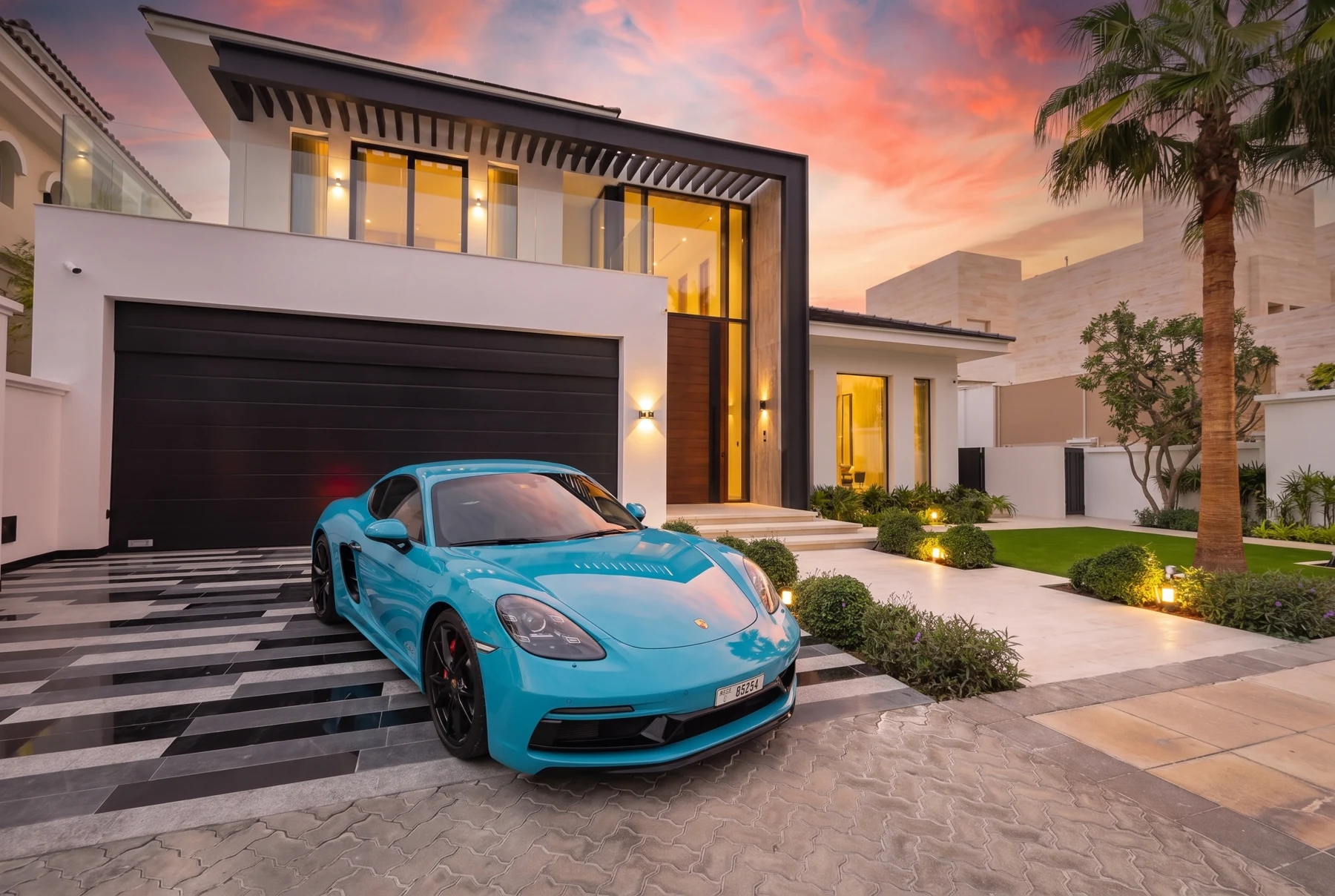 Palm Jumeirah villa under a pink sunset