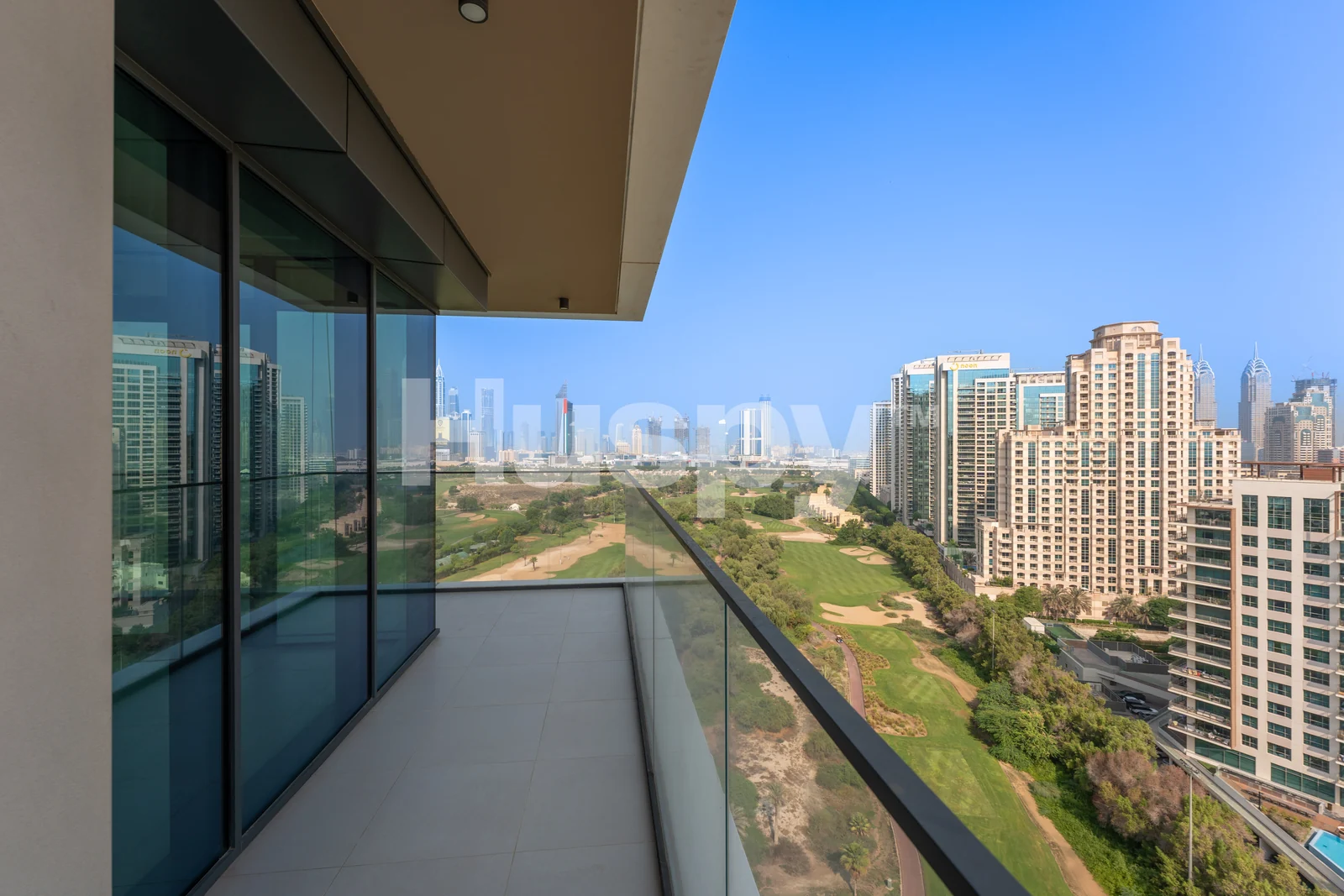 Golf Heights balcony overlooking the fairways and Dubai skyline