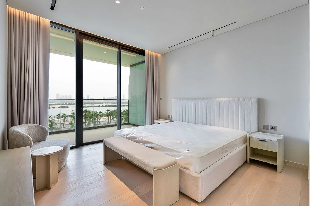 Furnished bedroom with fitted wardrobes