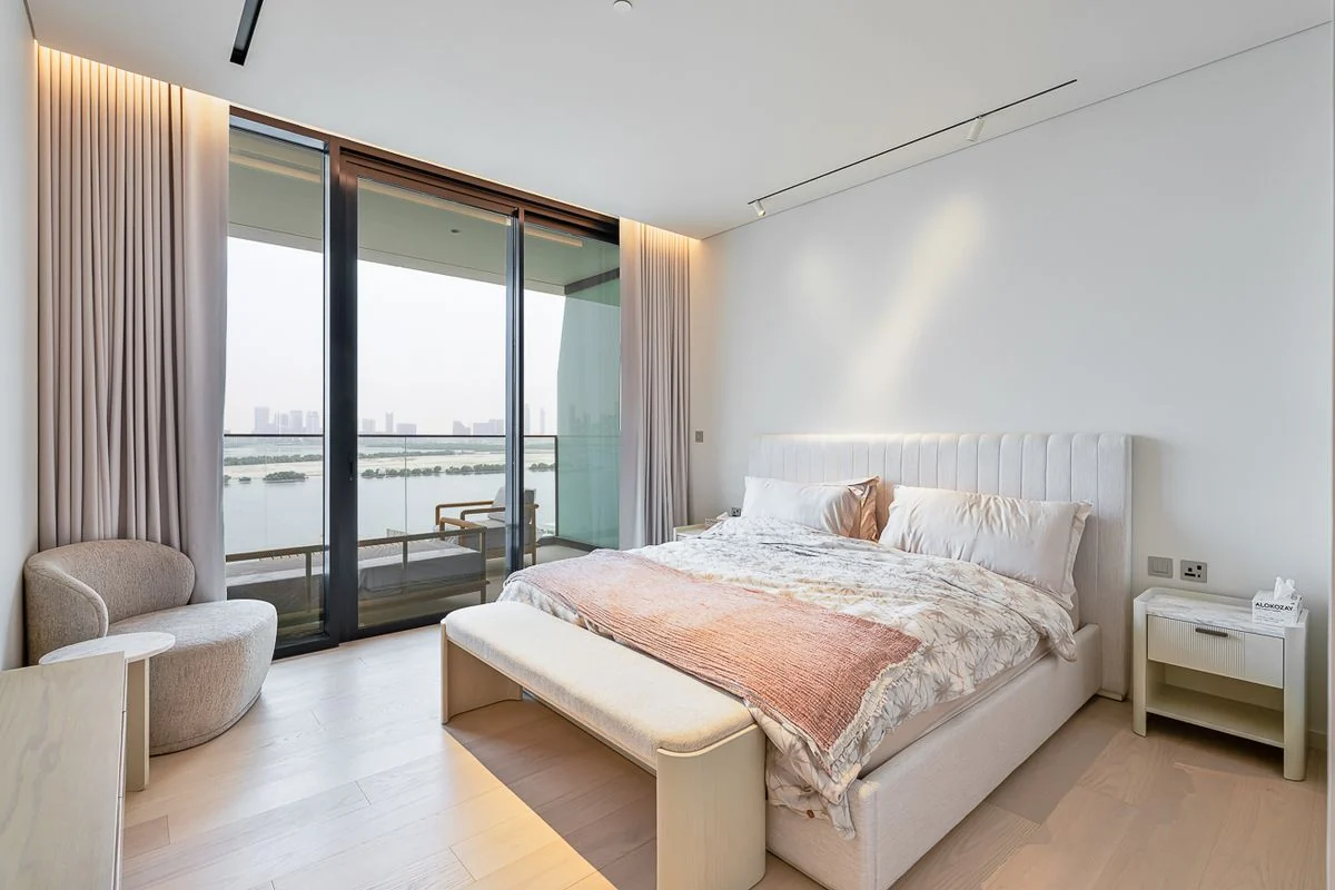 Furnished bedroom with fitted wardrobes