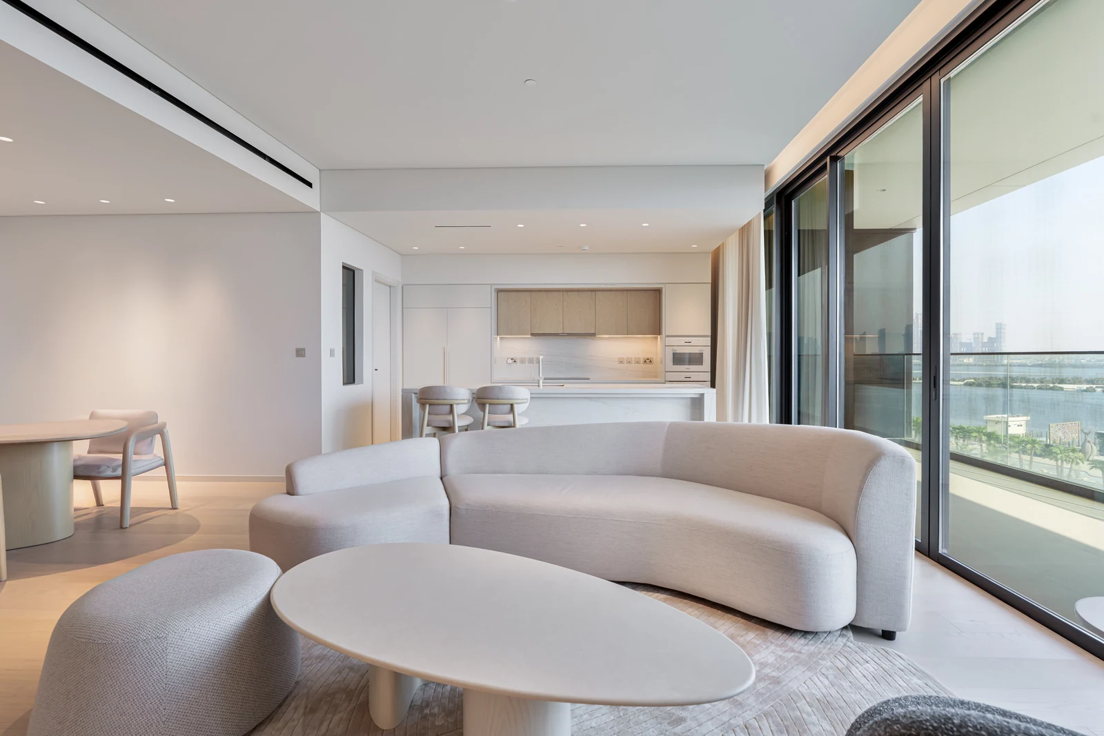 Living room and kitchen at Kempinski Residences The Creek