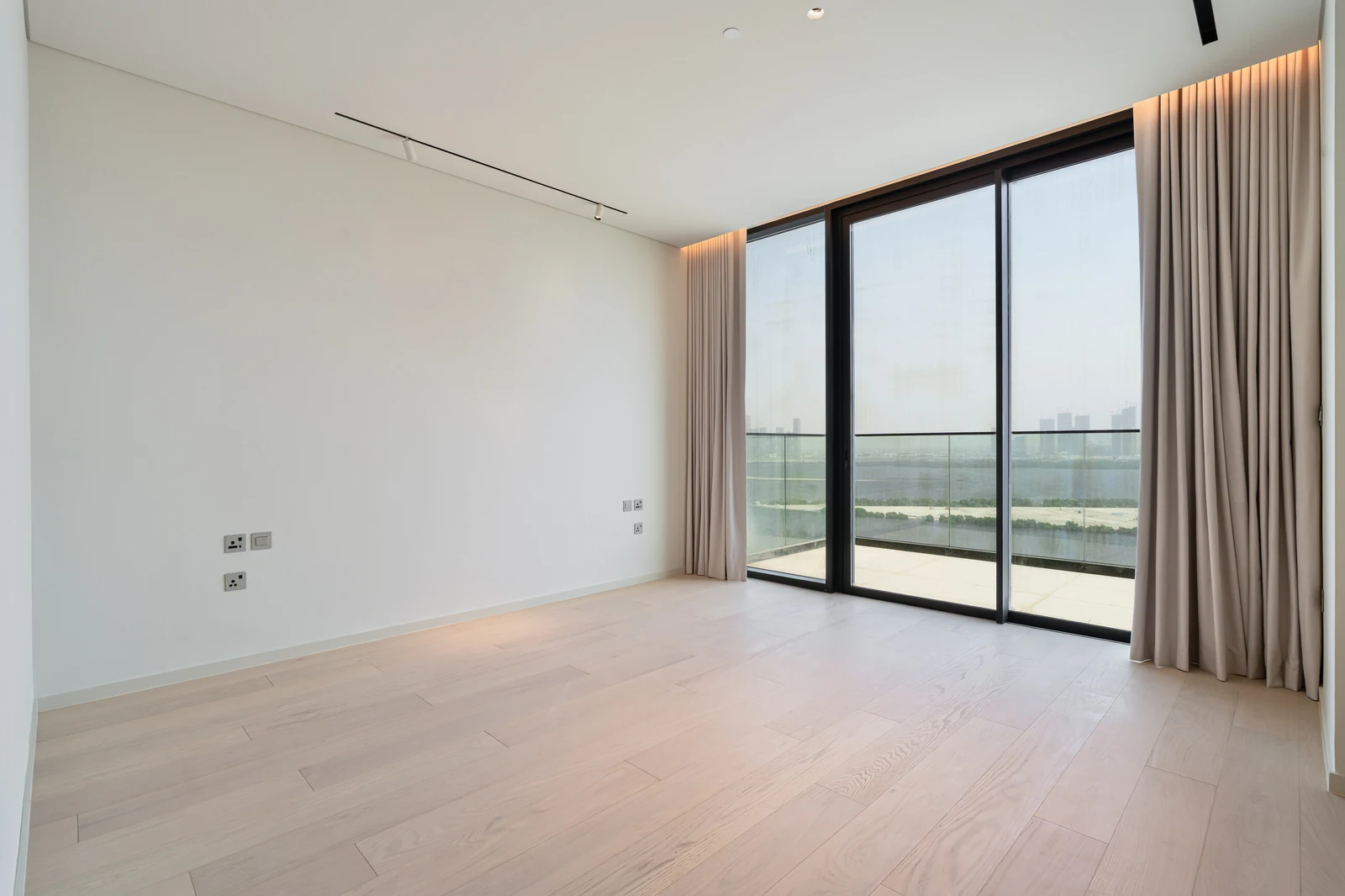 Bedroom with terrace doors and Creek views
