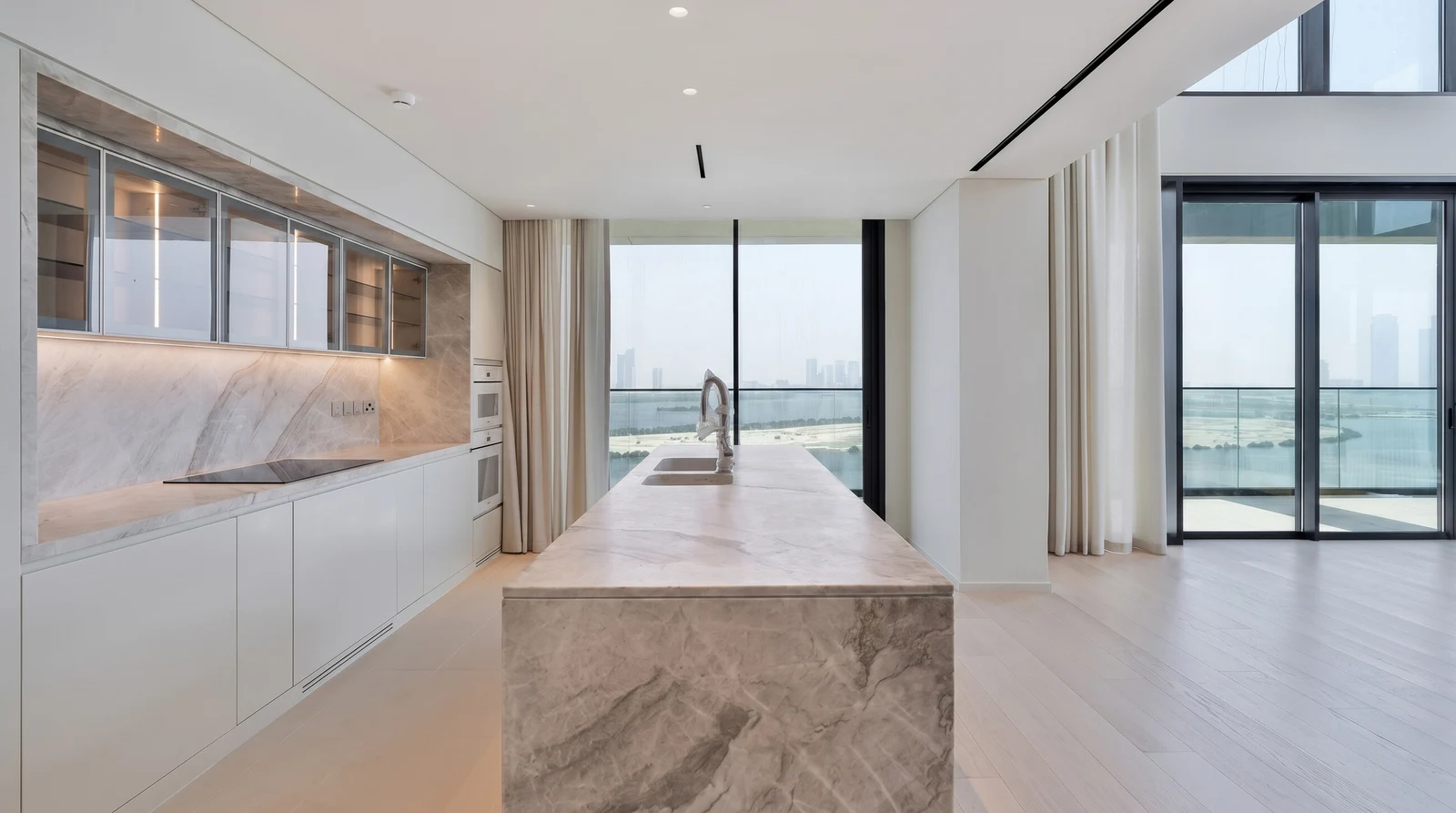 Marble kitchen island beside terrace doors