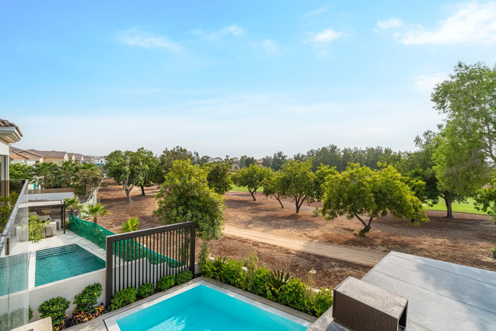 View across the pool towards the golf course
