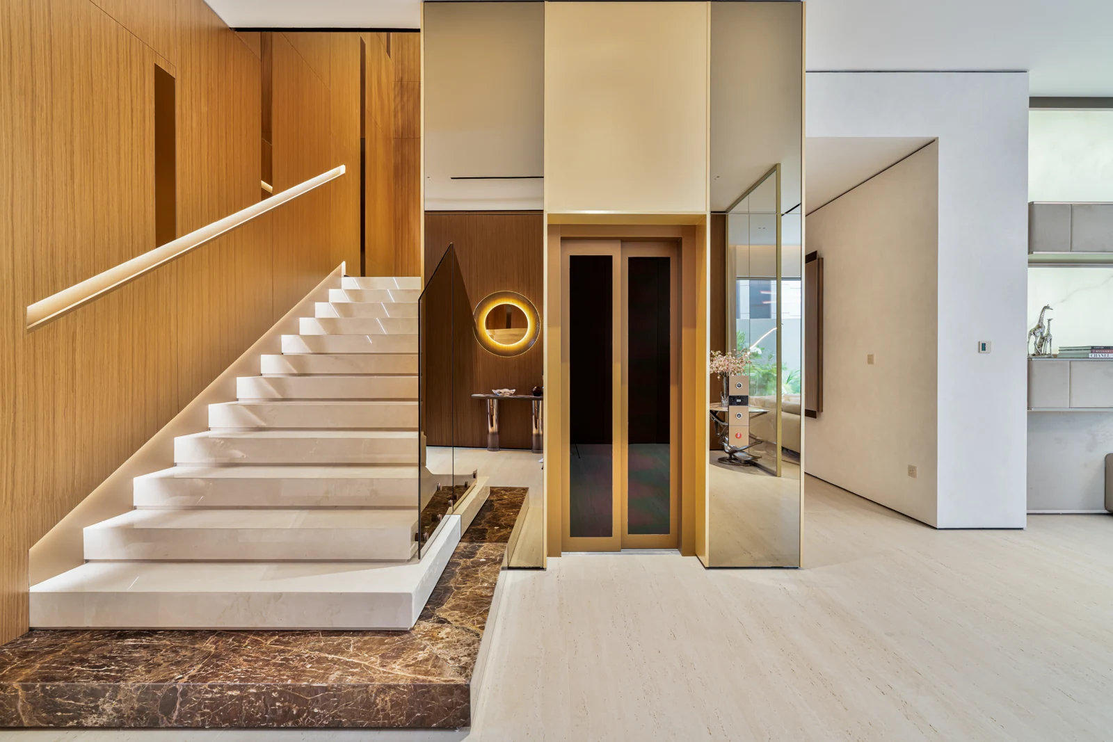 Floating staircase beside the timber feature wall
